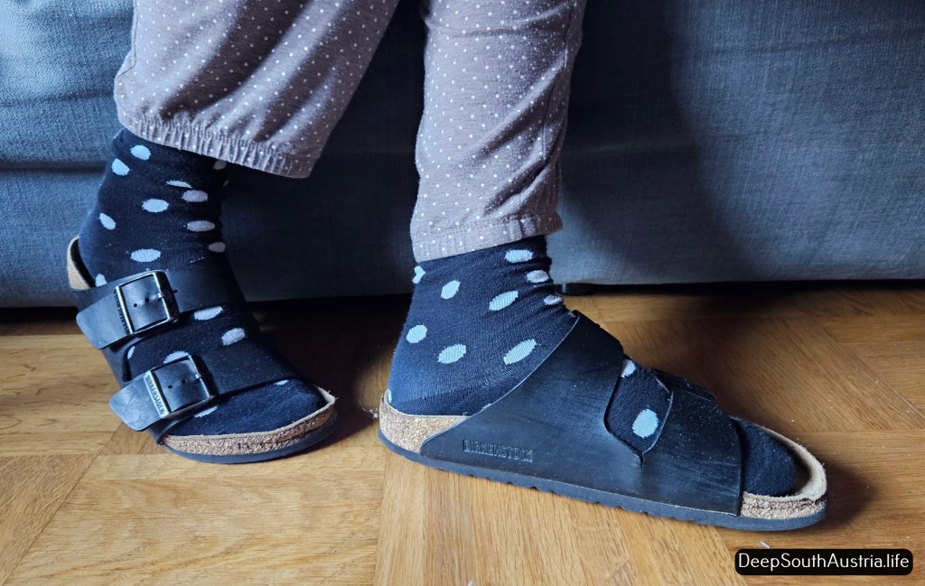 Birkenstock sandals worn with socks. 