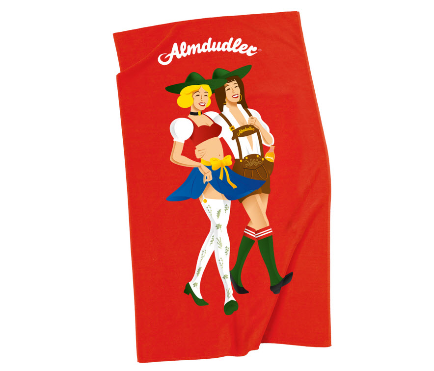 A lesbian couple on an Almdudler towel