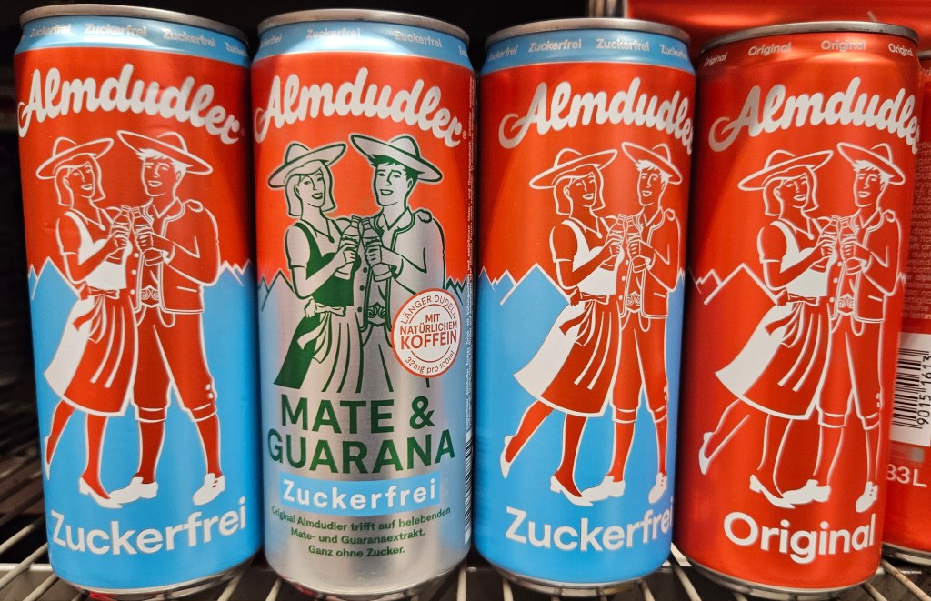 Cans of Almdudler drink on supermarker shelf in Austria