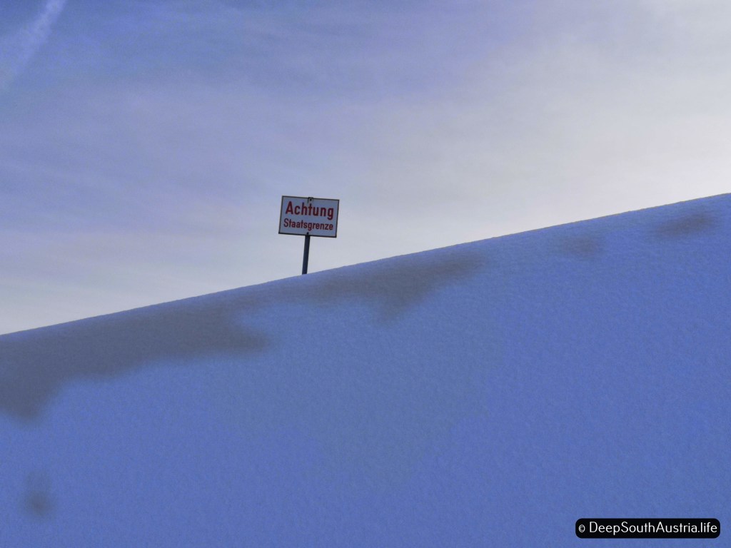Border sign at Dreiländereck ski resort, in Carinthia, Austria.